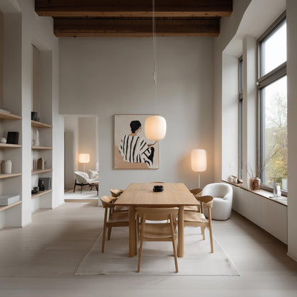 Figurative Canvas Wall Art Woman Reading Book in Black and White Striped Dress Neutral Background