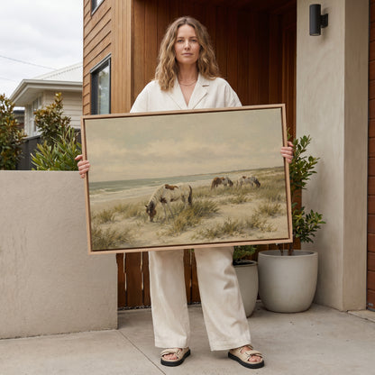 Ocean canvas wall art showing wild ponies grazing on a dune beach beside pale ocean surf