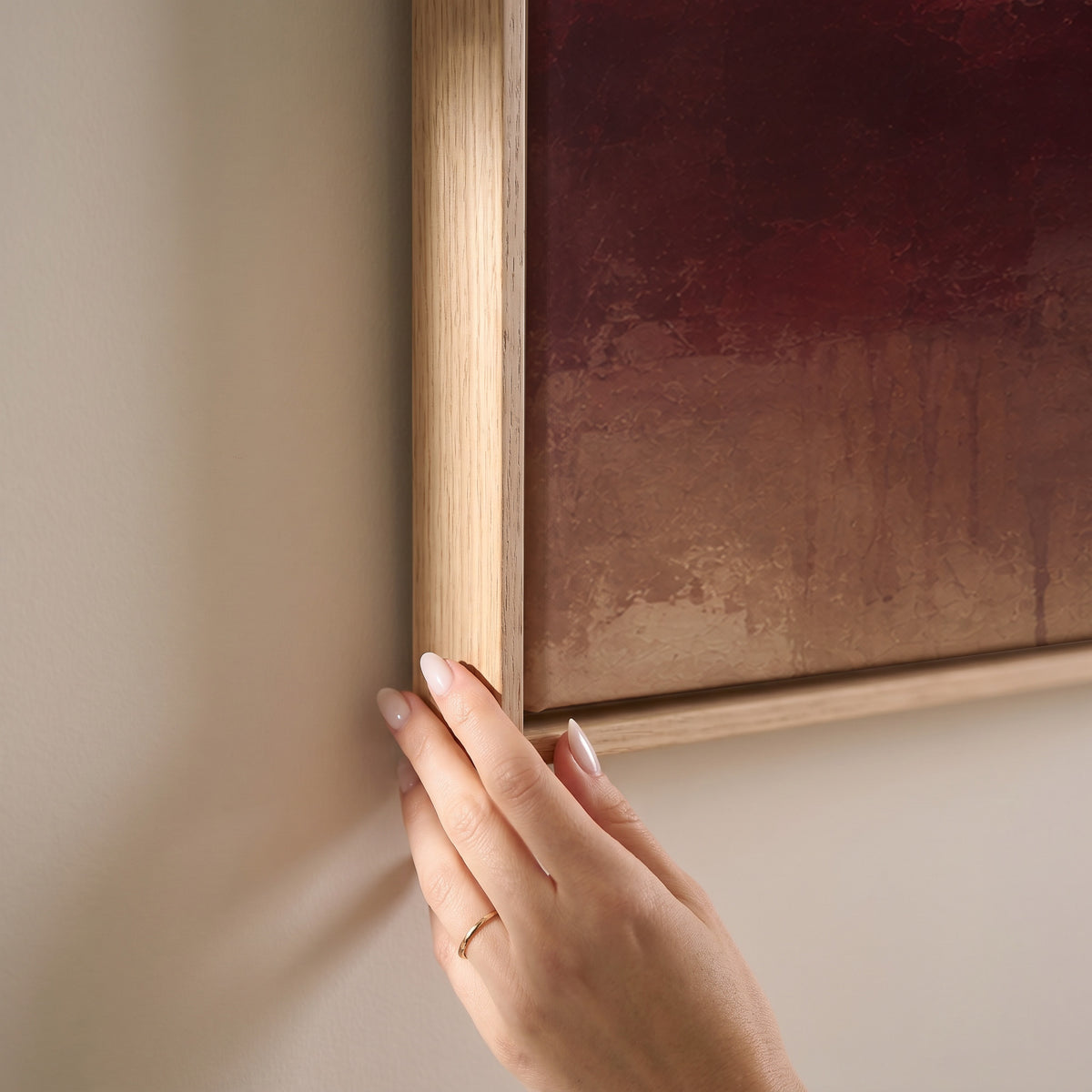 Abstract painting with a burgundy mass, mauve column and one gold bar on warm beige, horizontal canvas print