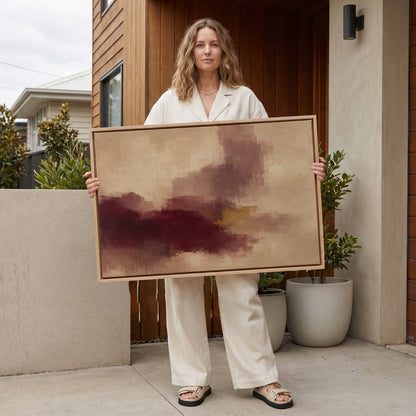 Modern abstract canvas wall art showing abstract painting with a burgundy mass, mauve column and one gold bar on warm beige