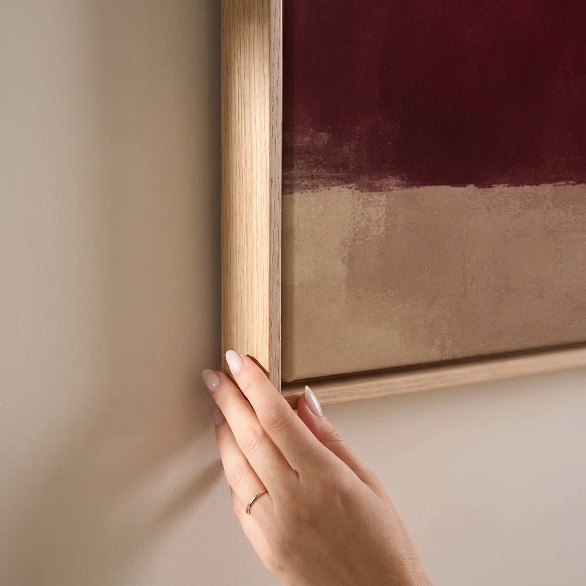 Colour block abstract with a deep burgundy form, grey violet column and gold band on cream, horizontal canvas print