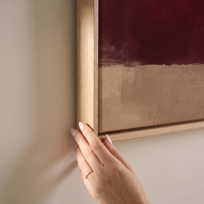 Colour block abstract with a deep burgundy form, grey violet column and gold band on cream, horizontal canvas print