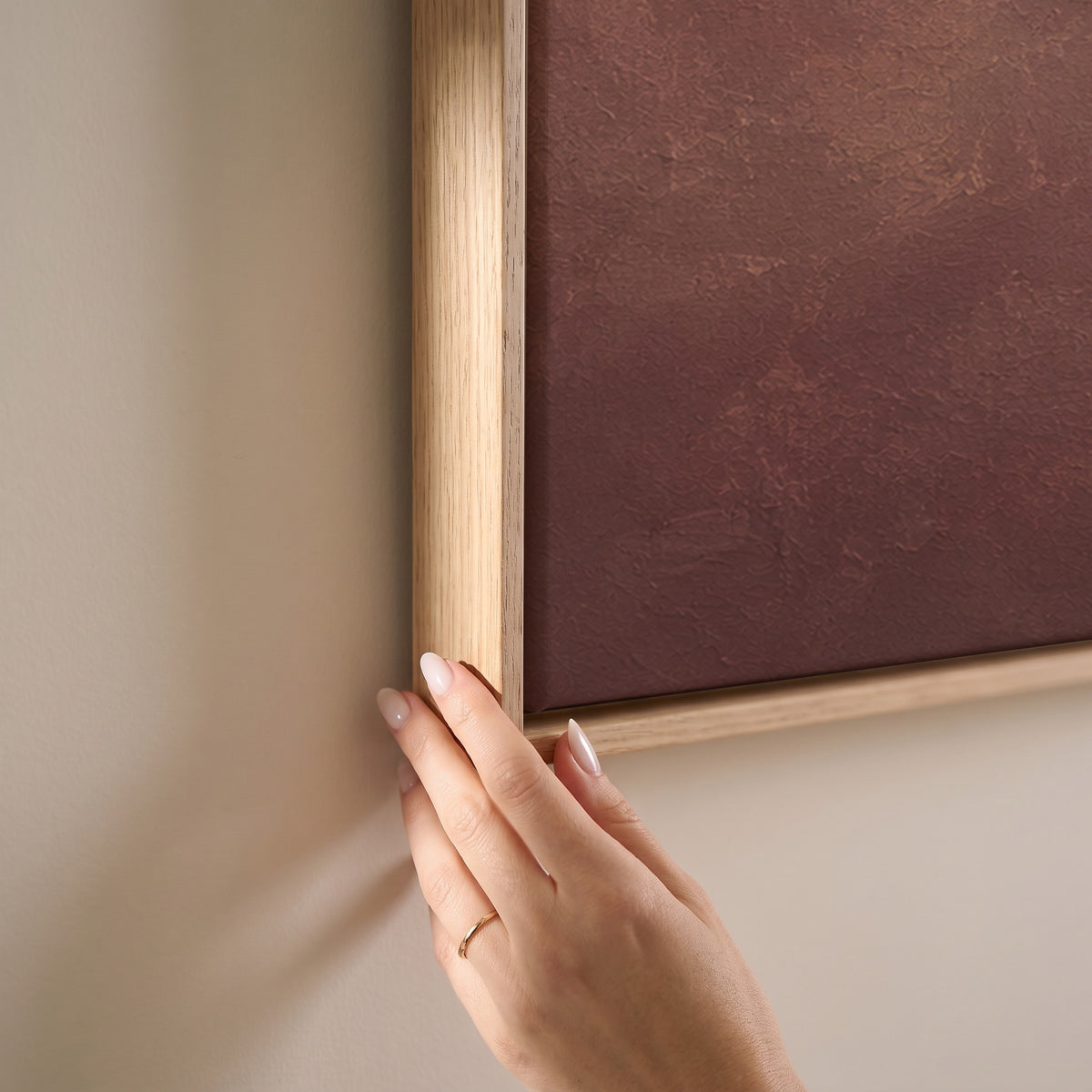 A scattered flock of small dark birds flying across a dusty rose and cream ground, horizontal canvas print