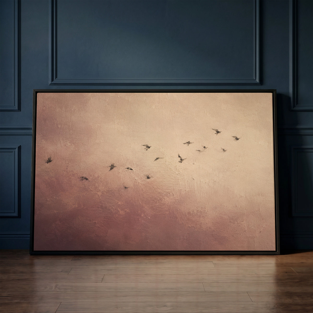 Wabi sabi canvas wall art showing a scattered flock of small dark birds flying across a dusty rose and cream ground