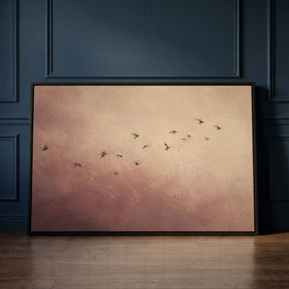 Wabi sabi canvas wall art showing a scattered flock of small dark birds flying across a dusty rose and cream ground
