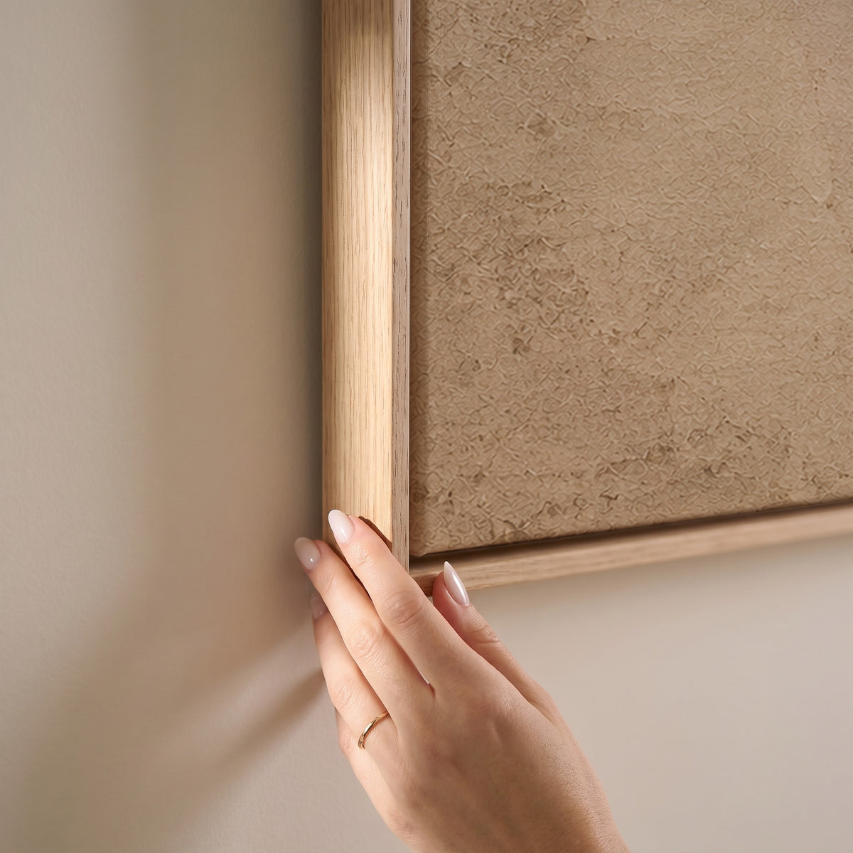 A single oxblood enso circle with an open gap, brushed on a warm cream ground, horizontal canvas print