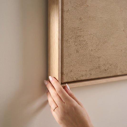 A single oxblood enso circle with an open gap, brushed on a warm cream ground, horizontal canvas print