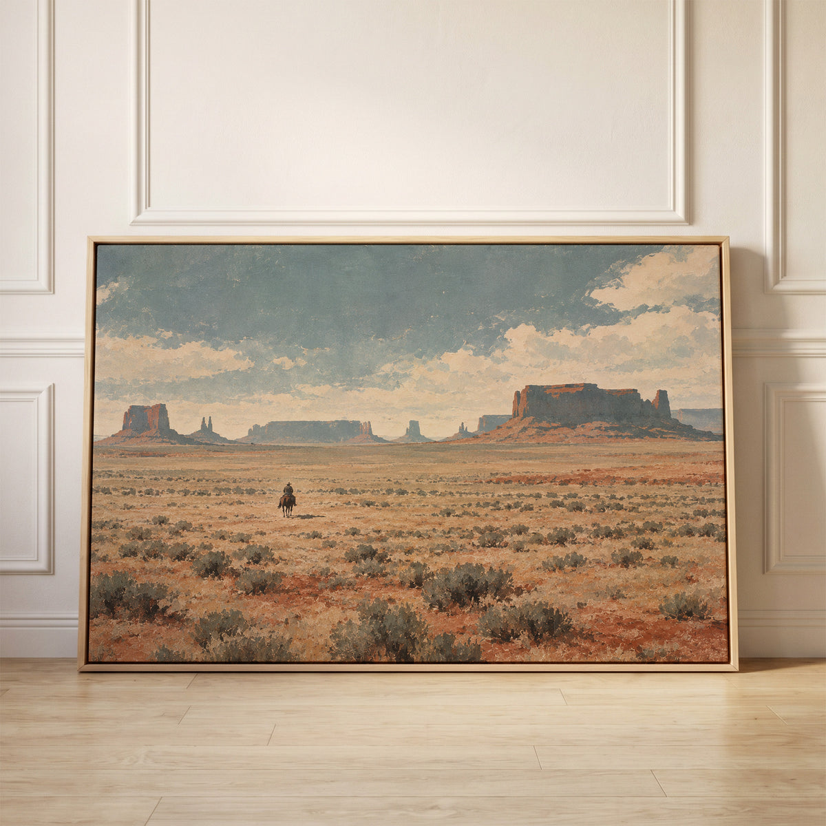Lone cowboy riding across a sagebrush plain below red desert mesas and buttes, canvas wall art