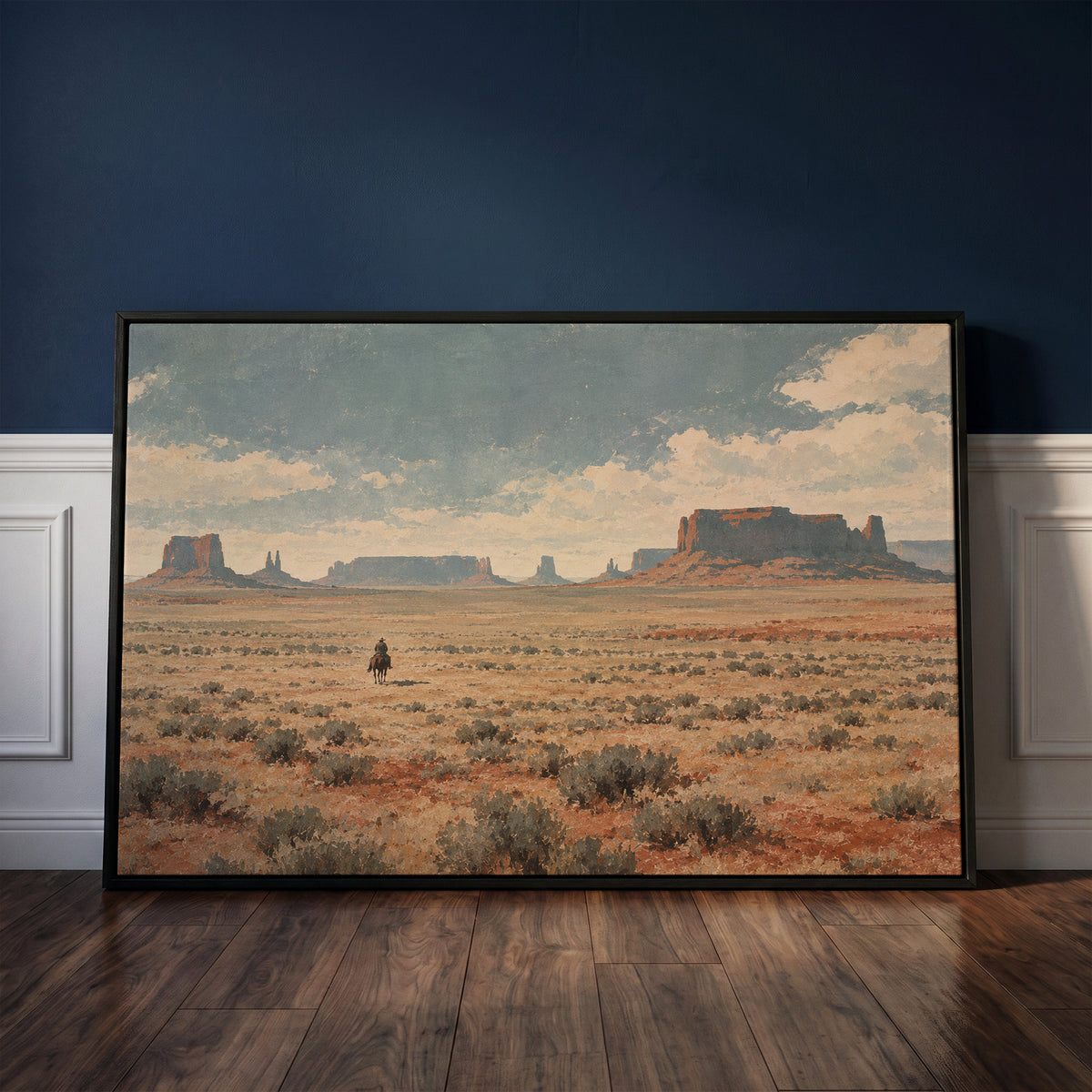 Lone cowboy riding across a sagebrush plain below red desert mesas and buttes, western canvas print