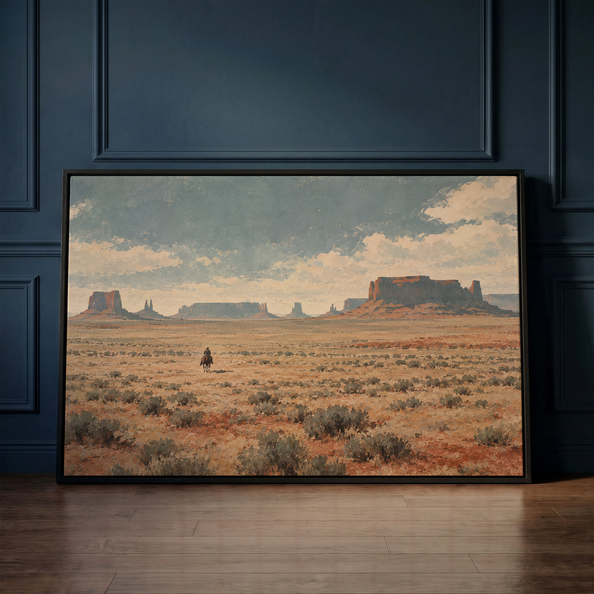 Western canvas wall art showing lone cowboy riding across a sagebrush plain below red desert mesas and buttes