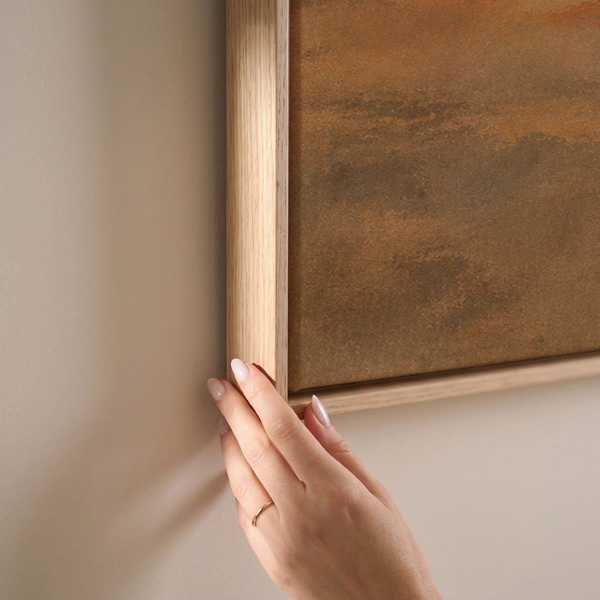 Small flock of dark birds flying across a warm ochre and rust coloured sky, horizontal canvas print