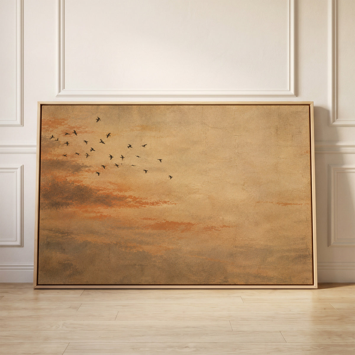 Small flock of dark birds flying across a warm ochre and rust coloured sky, canvas wall art
