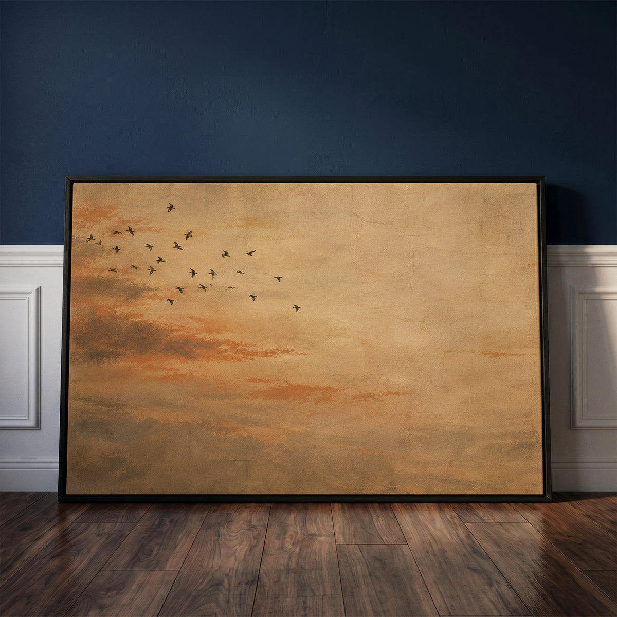Nature canvas wall art showing small flock of dark birds flying across a warm ochre and rust coloured sky