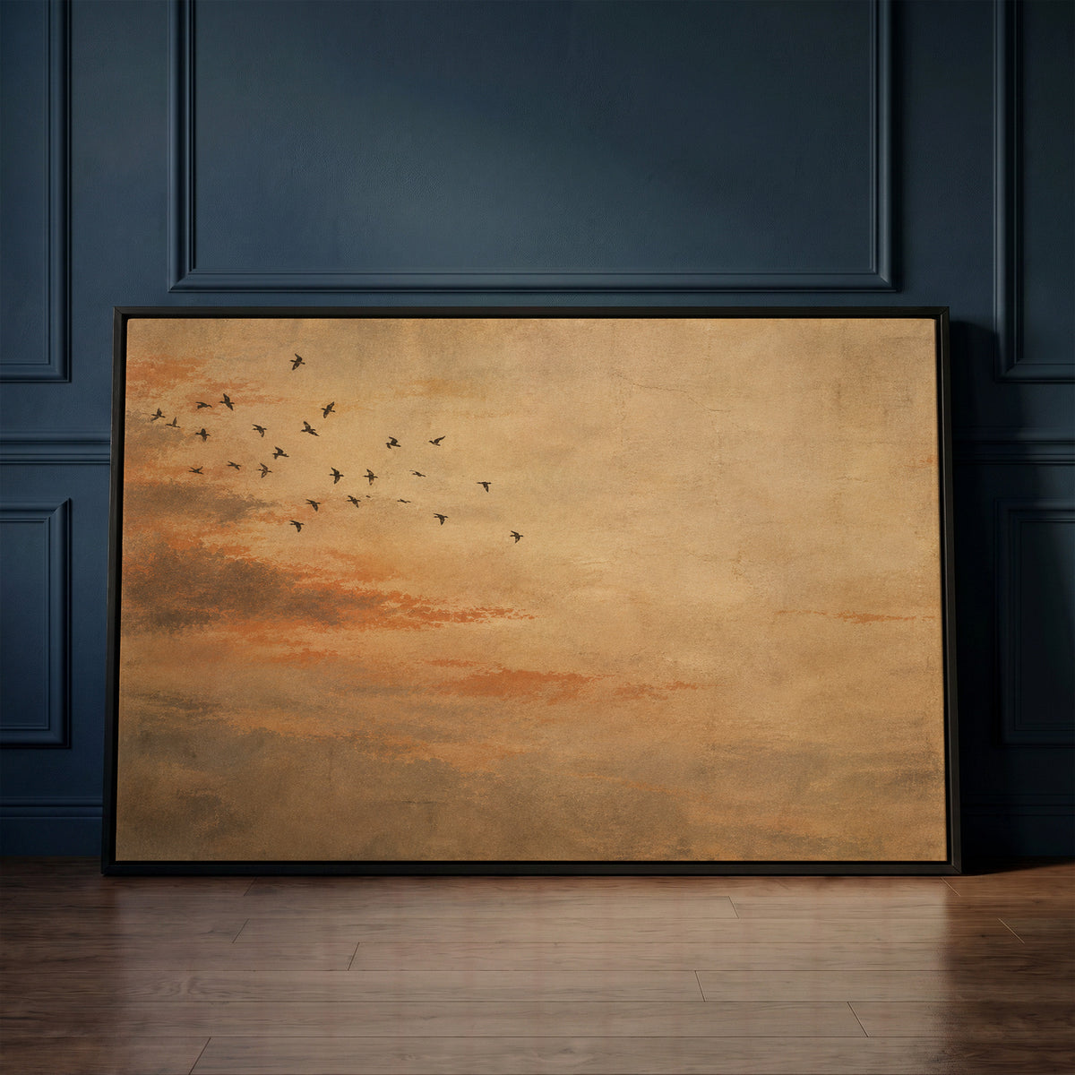 Sky canvas wall art showing small flock of dark birds flying across a warm ochre and rust coloured sky