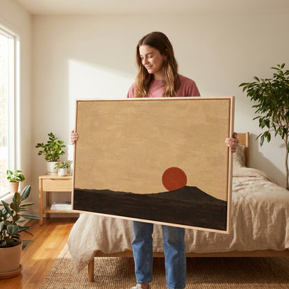 Zen canvas wall art showing rust red sun disc resting on the shoulder of a dark volcanic cone at dusk