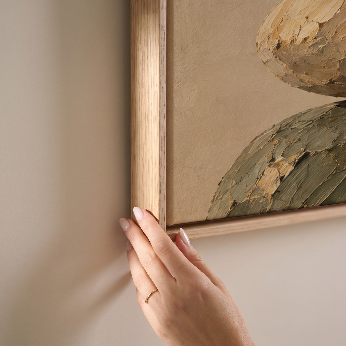 Five balanced stones stacked in a cairn against a plain warm cream ground, horizontal canvas print