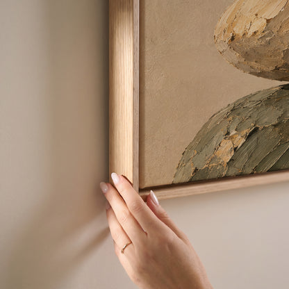 Five balanced stones stacked in a cairn against a plain warm cream ground, horizontal canvas print