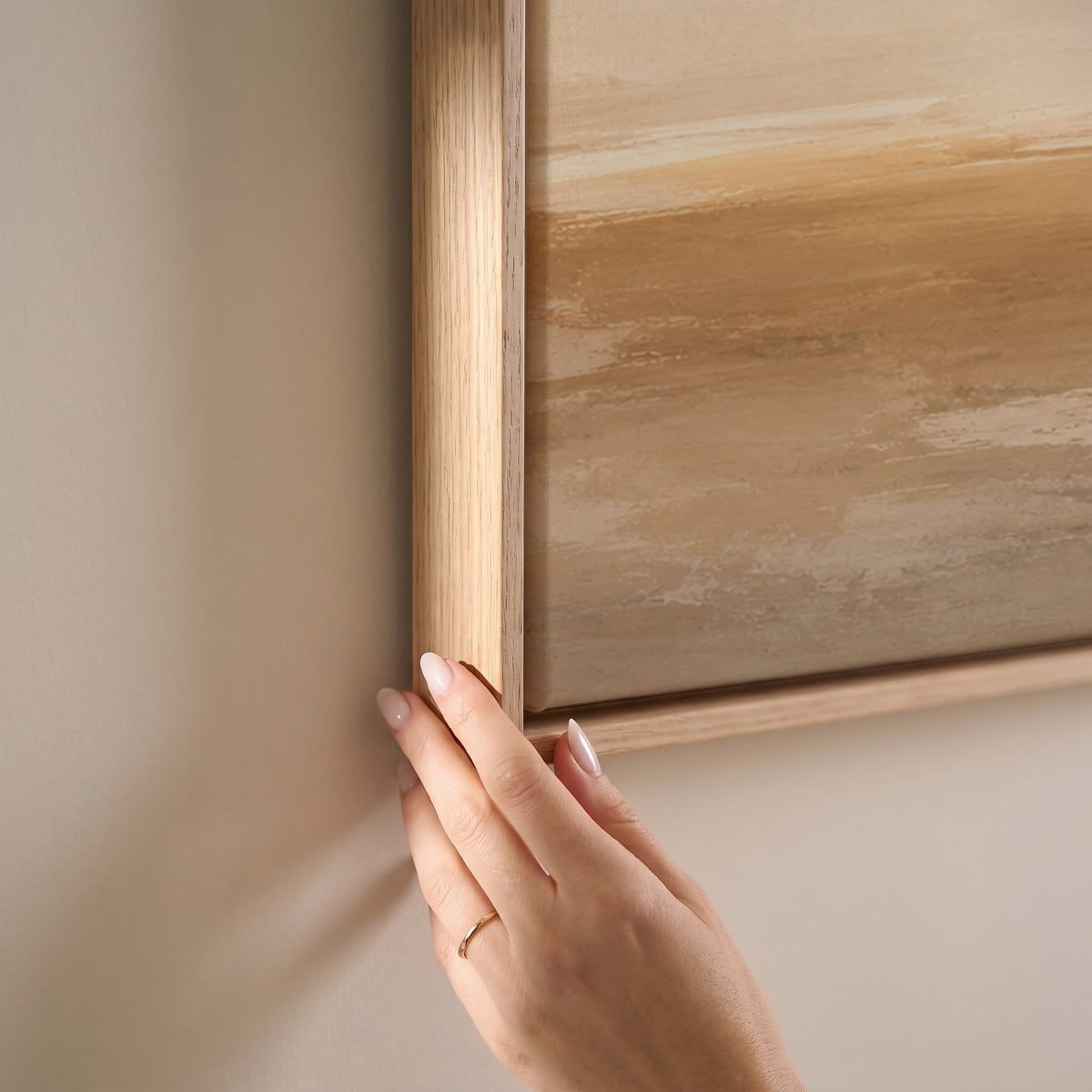 Wide pale sky over a soft ochre shoreline with light breaking along the horizon, horizontal canvas print