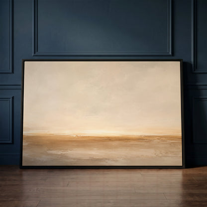 Beige canvas wall art showing wide pale sky over a soft ochre shoreline with light breaking along the horizon