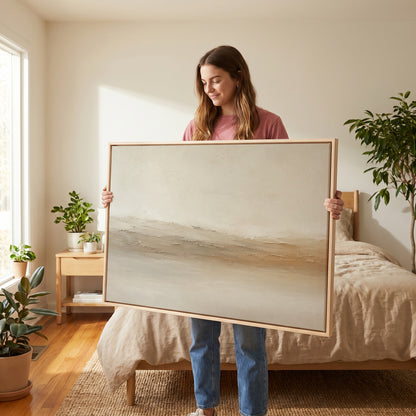 Scraped paint canvas wall art showing pale abstract landscape with a scraped ridge of cream and ochre across the middle