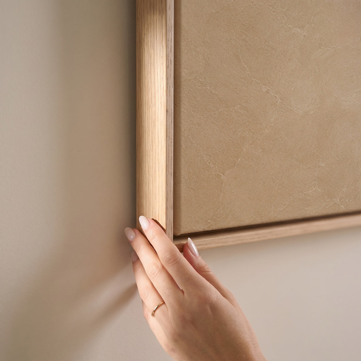 A tall S-curved brushstroke in cream and caramel on a warm sand ground, horizontal canvas print