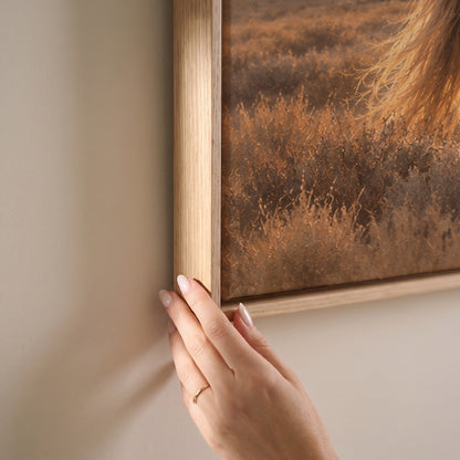 A grey and a chestnut wild horse resting head to head on a sagebrush plain at sunset, horizontal canvas print