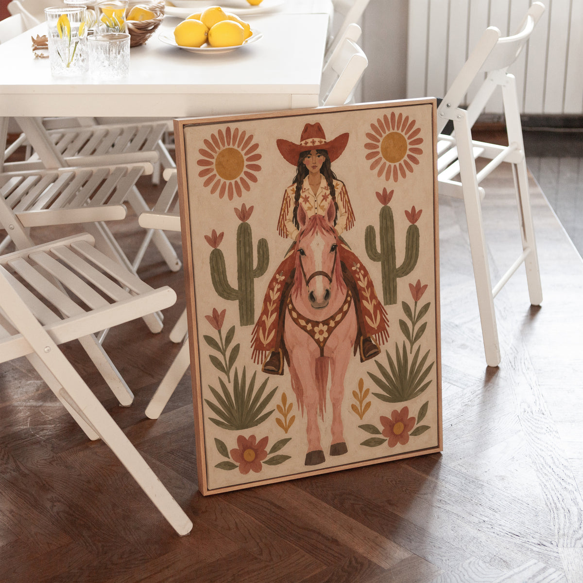 Folk art cowgirl on a pink horse framed by cacti and flowers, canvas art print