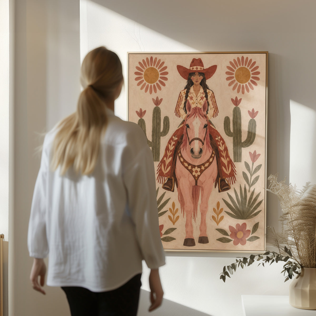 Pink horse canvas wall art showing folk art cowgirl on a pink horse framed by cacti and flowers