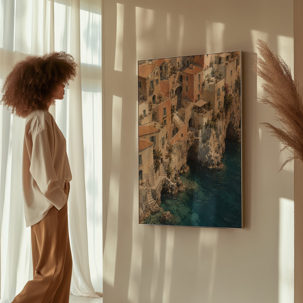 Mediterranean canvas wall art showing cliffside Mediterranean village seen from above with turquoise sea below