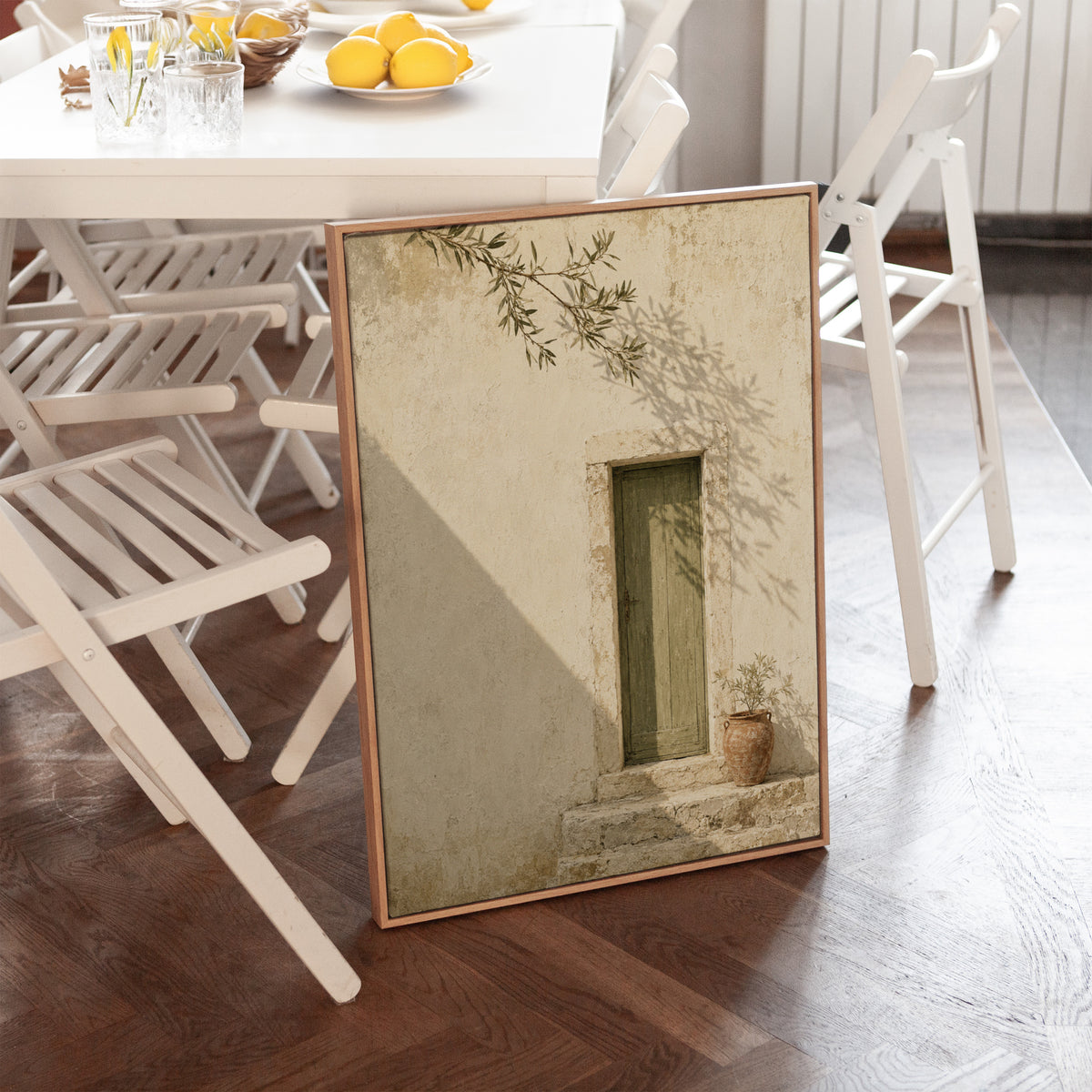 Terracotta canvas wall art showing weathered green door in a bone limestone wall with olive branch shadows
