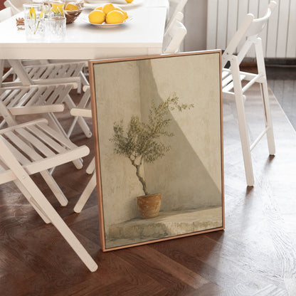 Summer canvas wall art showing small olive tree in a terracotta pot in a sunlit courtyard corner