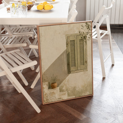 Sage green louvred shutters on a bone wall with an olive branch above, canvas print