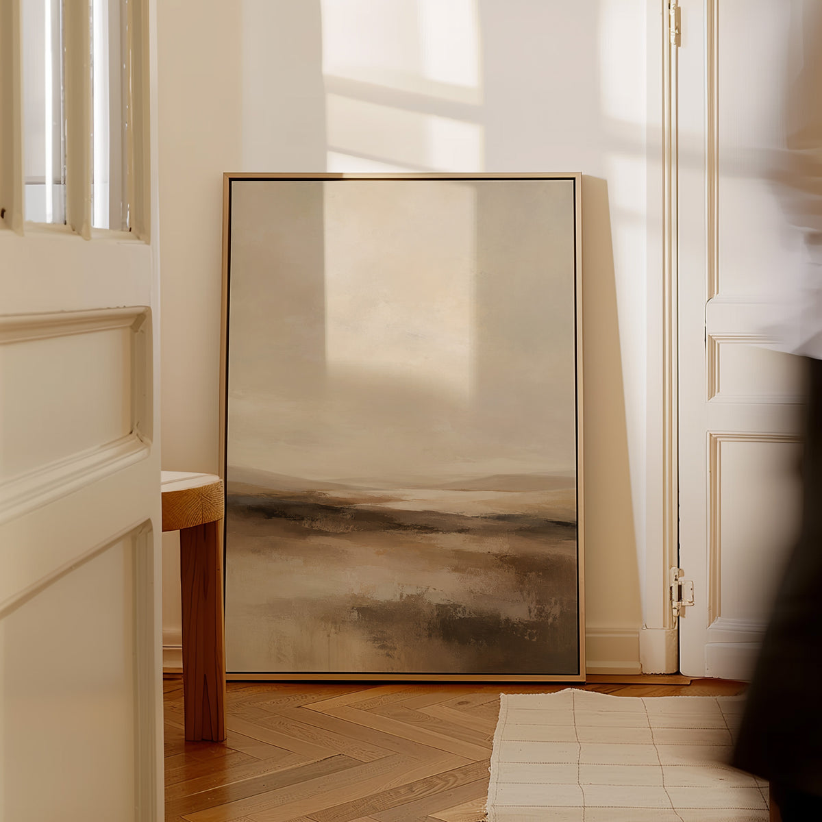 Modern canvas wall art showing abstract neutral landscape with a pale sky and layered bands of brown and cream