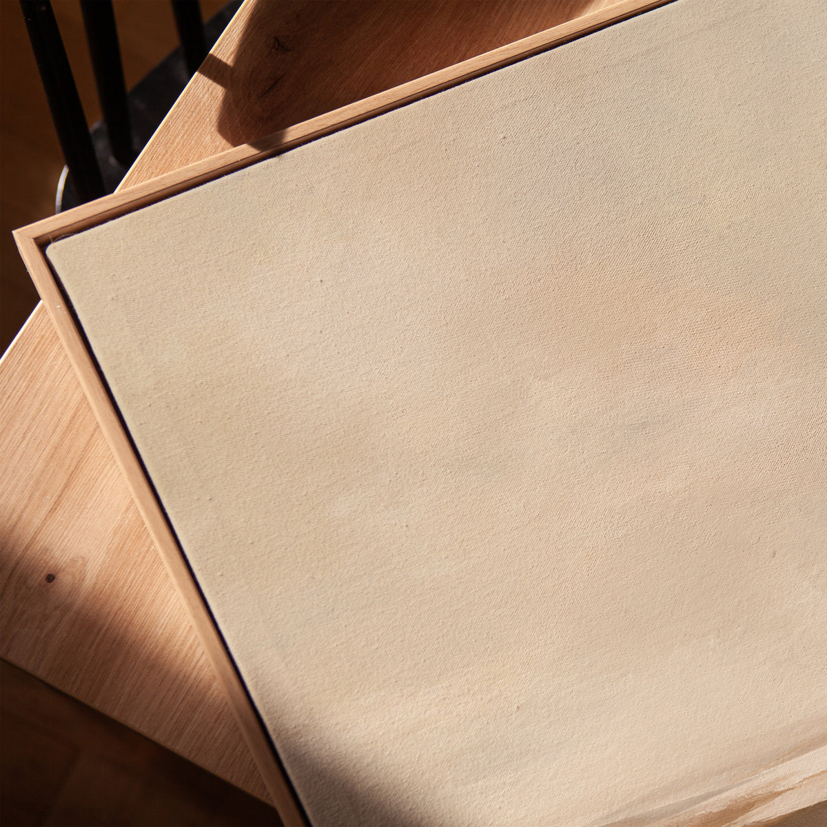 Abstract neutral landscape with a pale sky and layered bands of brown and cream, vertical canvas print