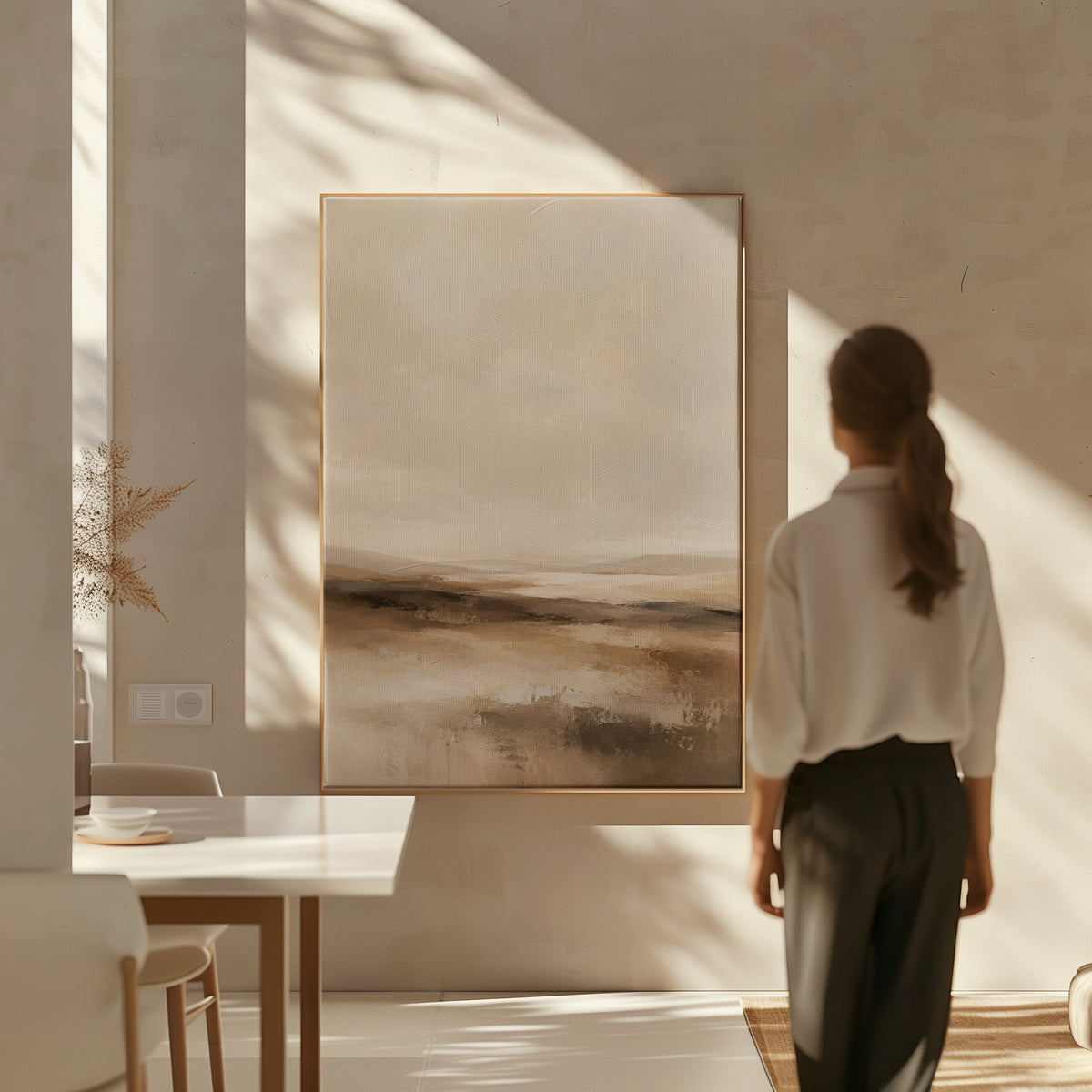 Calm canvas wall art showing abstract neutral landscape with a pale sky and layered bands of brown and cream