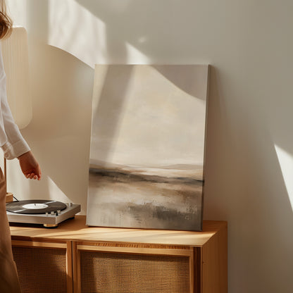 Neutral canvas wall art showing abstract neutral landscape with a pale sky and layered bands of brown and cream