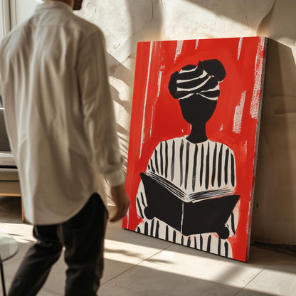 Figurative Canvas Wall Art Woman Reading in Black and White Striped Outfit on Red Background Frame