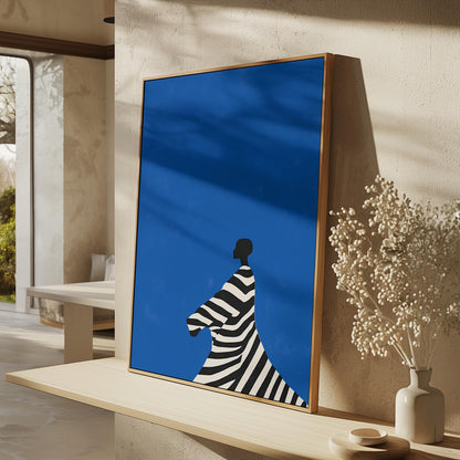 Figurative Canvas Wall Art Woman in Black and White Striped Dress on Bold Blue Background Framed Print