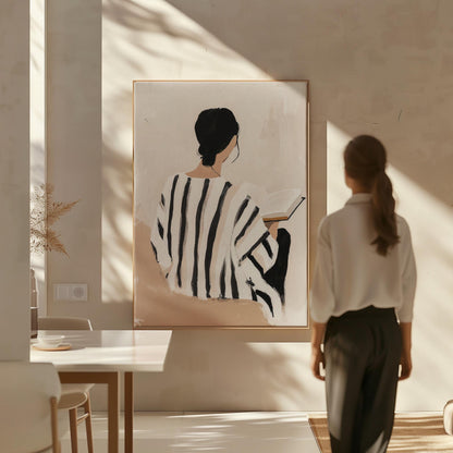 Figurative Canvas Wall Art Woman Reading Book in Black and White Striped Dress Neutral Background