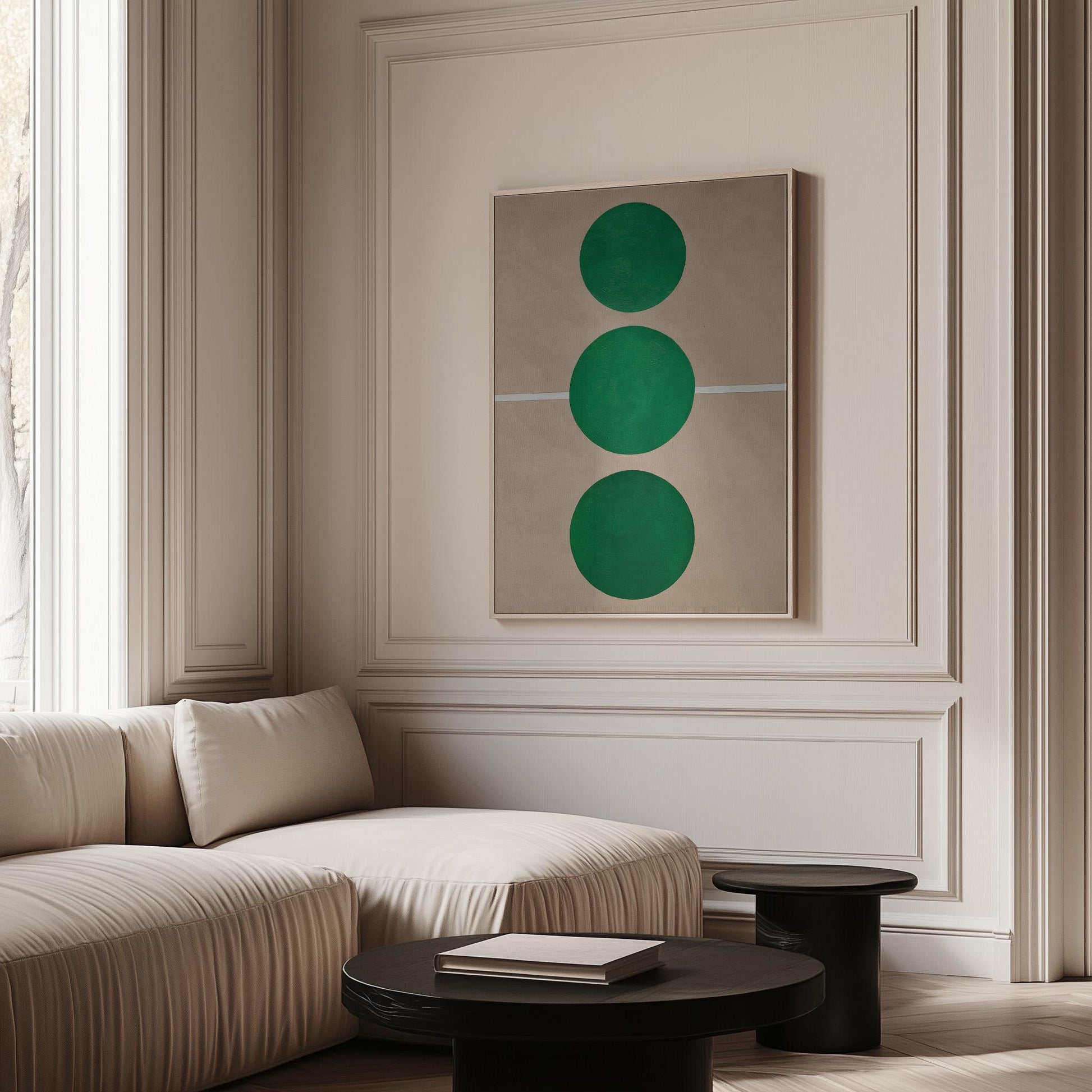 a modern living room with a large window, a white sofa, a black coffee table, and a framed abstract artwork featuring three green circles on the wall.