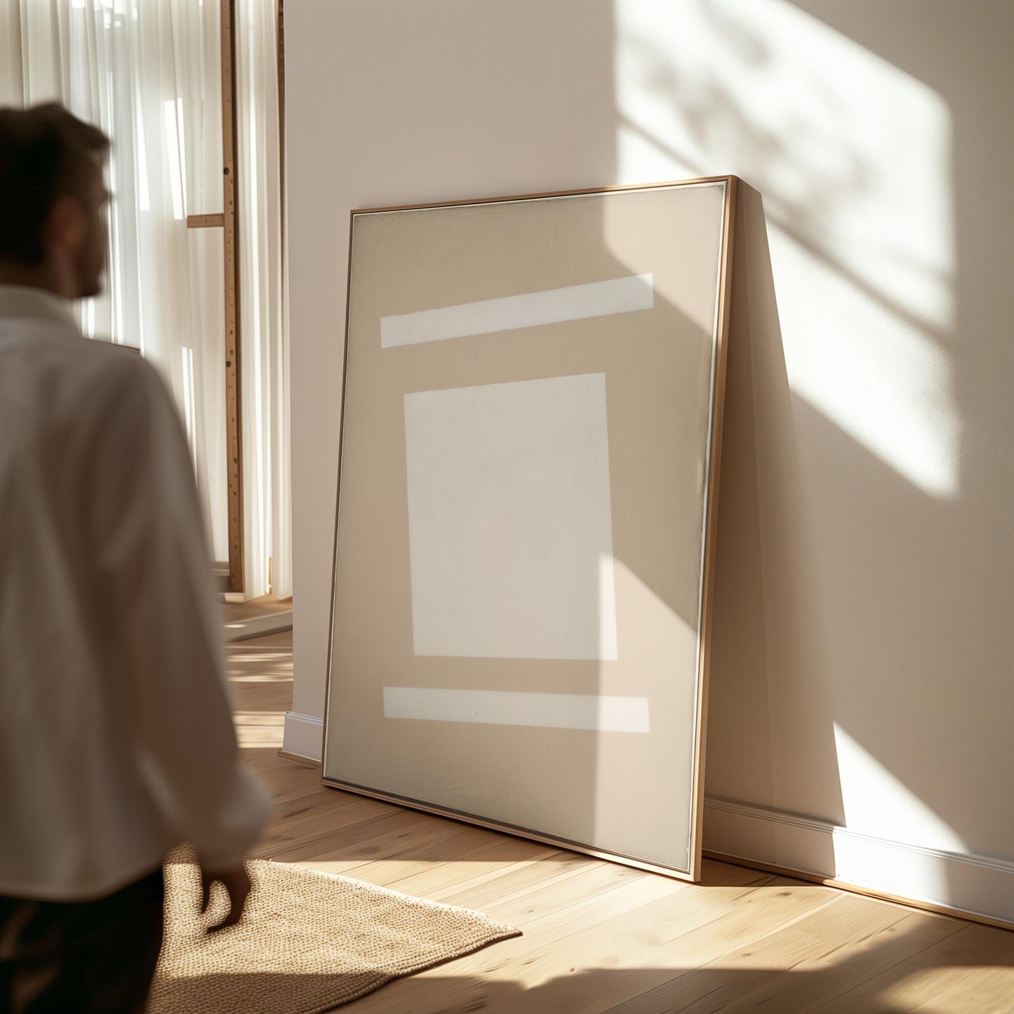 a person standing in a room with a large, abstract painting on the wall. The painting features a white square and a horizontal line, creating a minimalist and modern aesthetic. The person appears to be observing the artwork, possibly appreciating its design or contemplating its meaning.