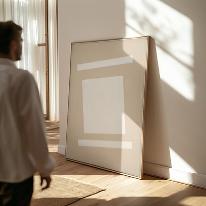 a person standing in a room with a large, abstract painting on the wall. The painting features a white square and a horizontal line, creating a minimalist and modern aesthetic. The person appears to be observing the artwork, possibly appreciating its design or contemplating its meaning.