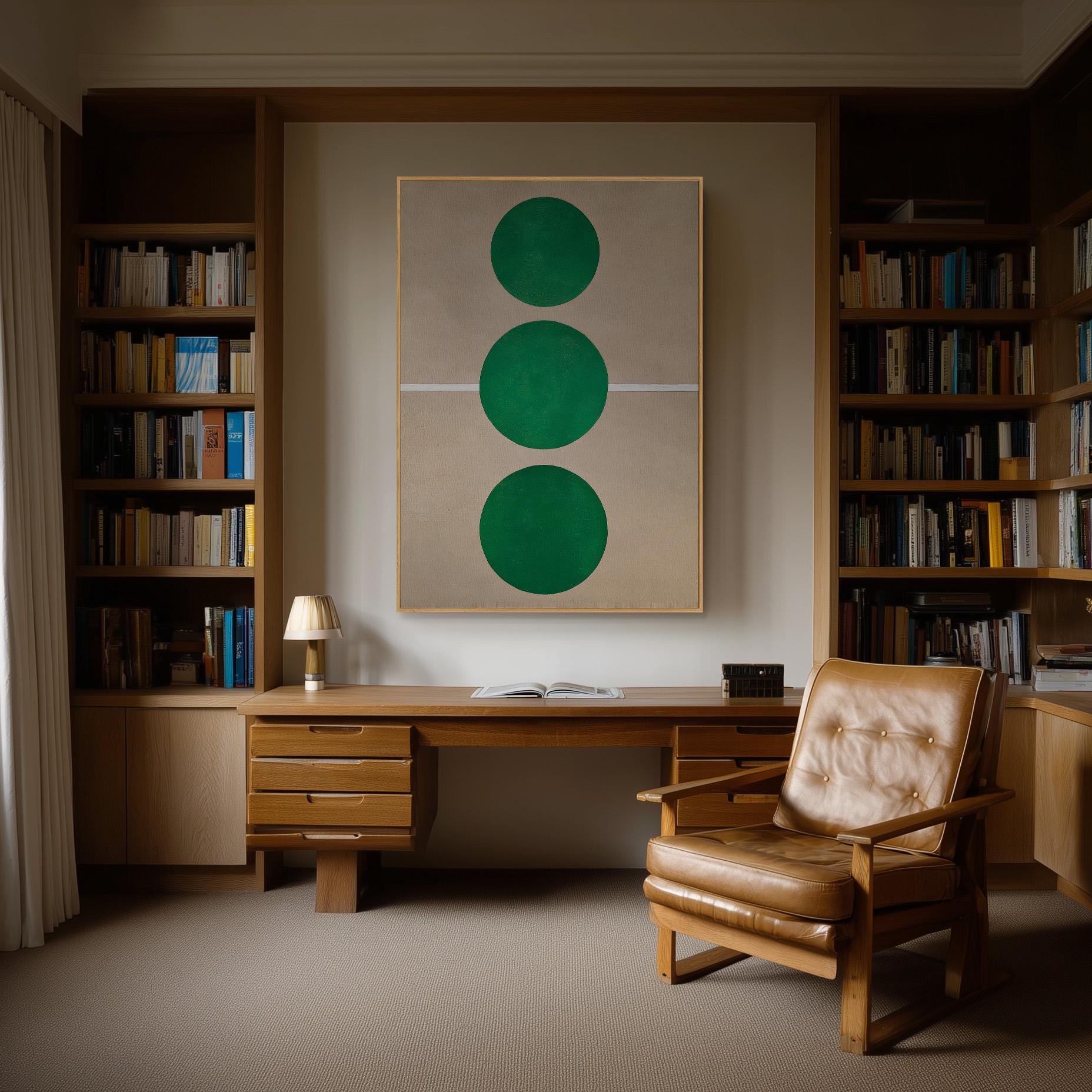 a cozy and well-organized home office with a desk, chair, and bookshelves filled with books. The room has a warm and inviting atmosphere, with a large abstract painting featuring three green circles on the wall.