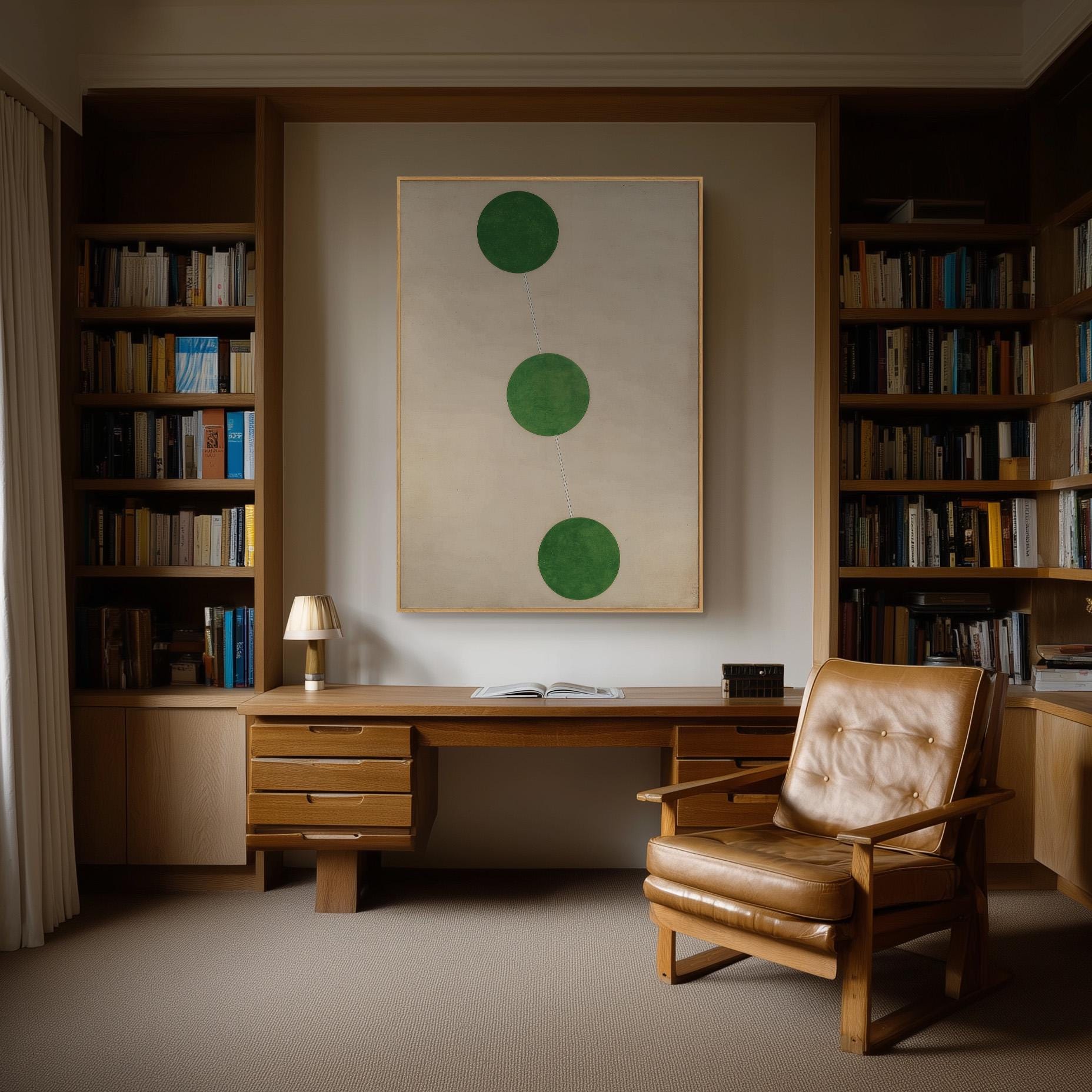 a cozy and well-organized home office with a wooden desk, a comfortable leather chair, and a large abstract painting featuring three green circles on the wall.