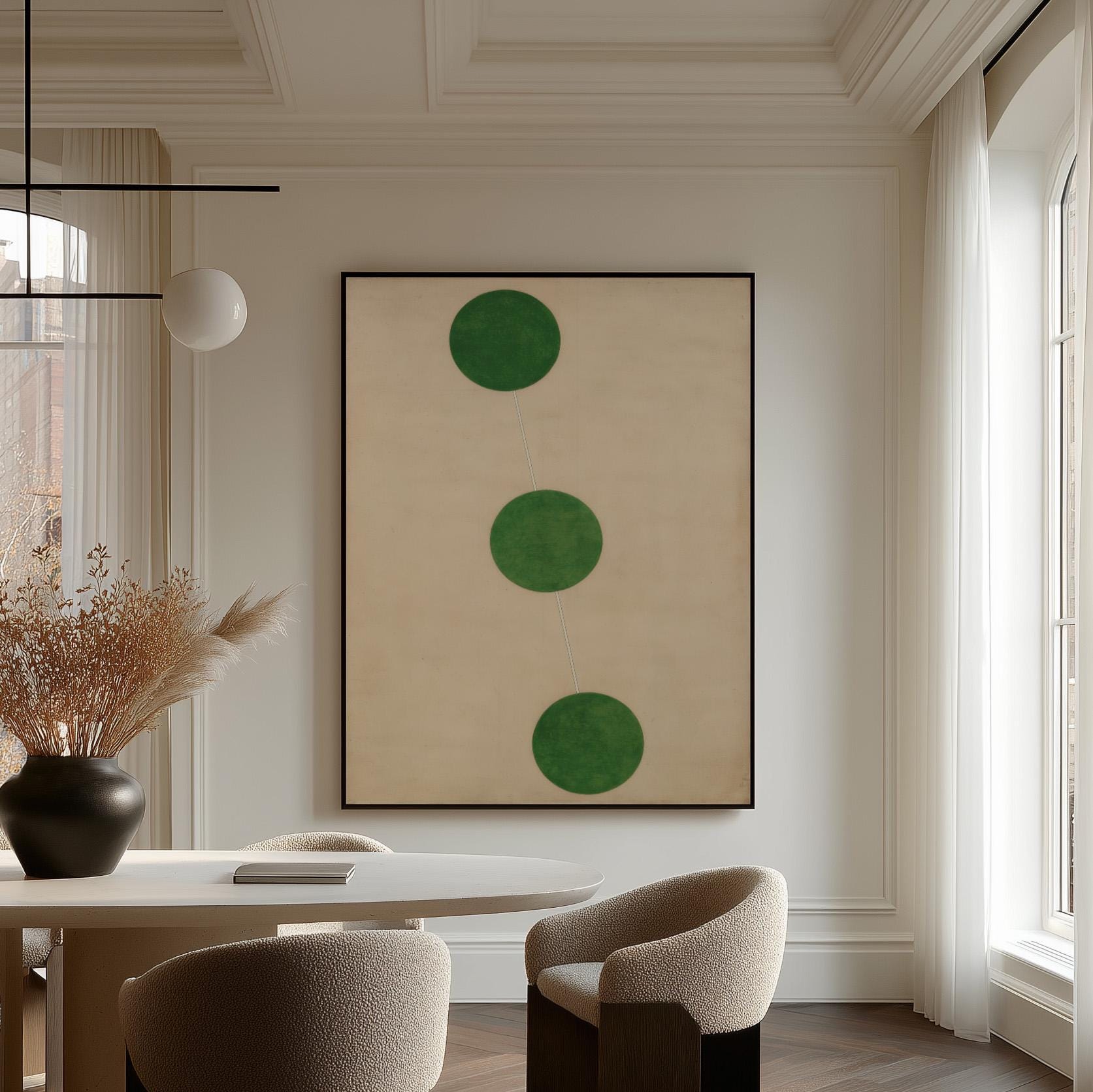 a modern dining room with a large abstract painting featuring three green circles on the wall. The room is furnished with a white table and chairs, and there is a vase of dried flowers on the table.
