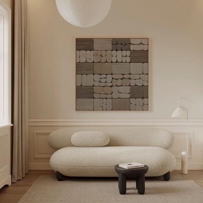 a modern living room with a large abstract painting on the wall, a white sofa, and a small black stool.