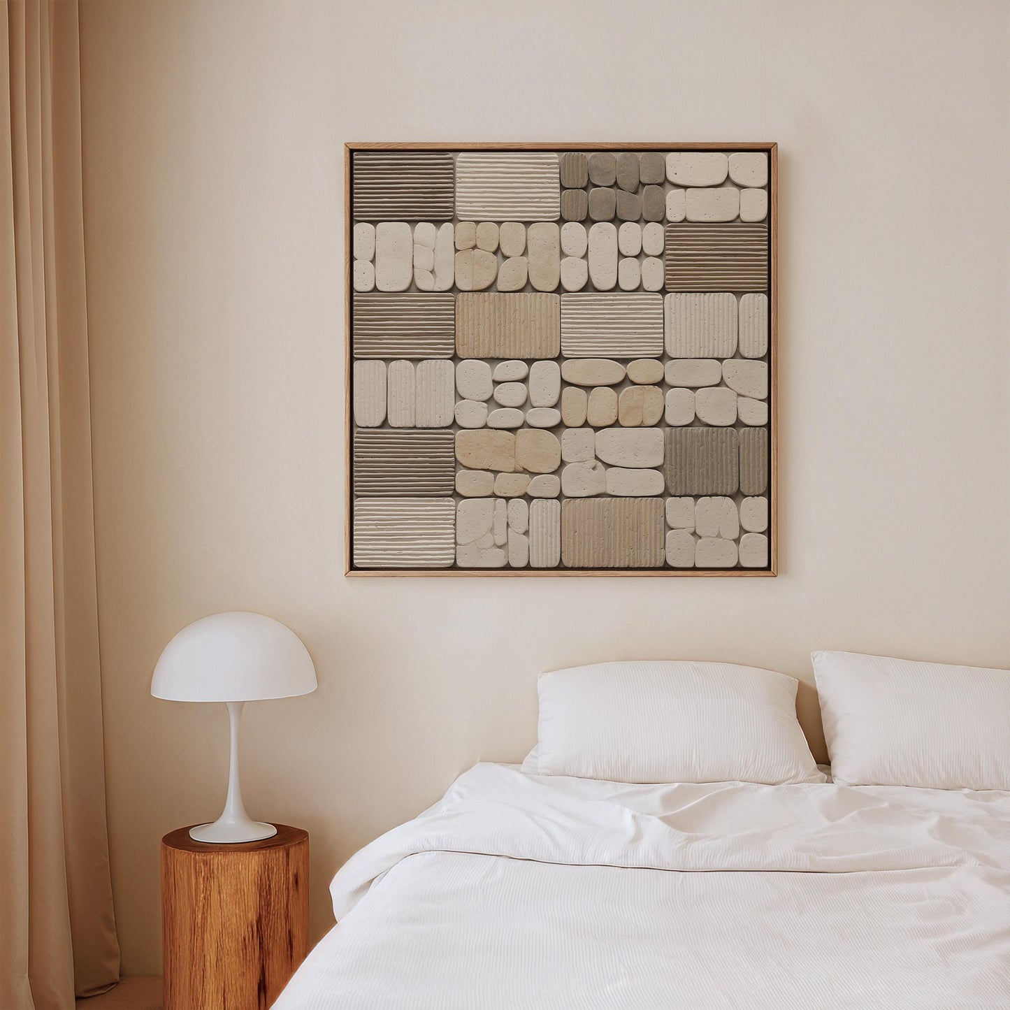 a bedroom with a bed, a nightstand, and a framed abstract artwork on the wall above the bed.