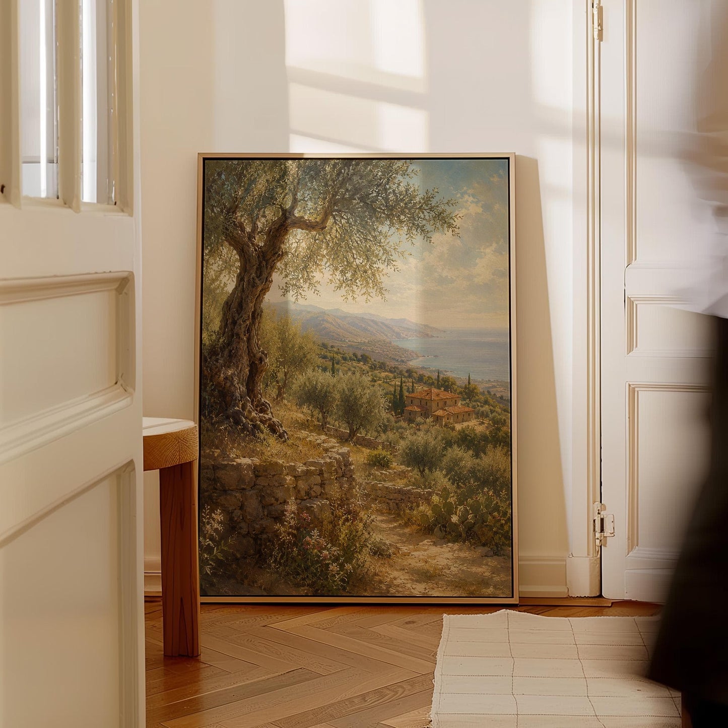 Old olive tree over a Mediterranean coastline, canvas print shown in a sunlit, contemporary room