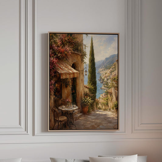 Italian village cafe painting with striped awning and coastal view, canvas print in a bright room with natural daylight