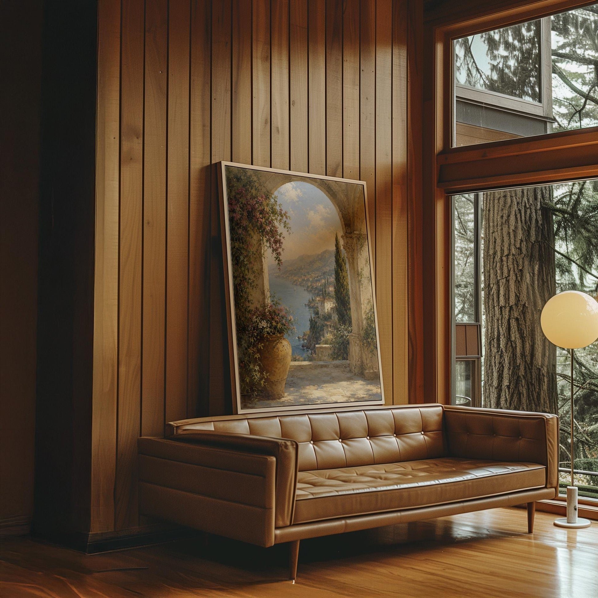 Mediterranean coastline seen through an old stone arch, canvas print shown in a sunlit, contemporary room
